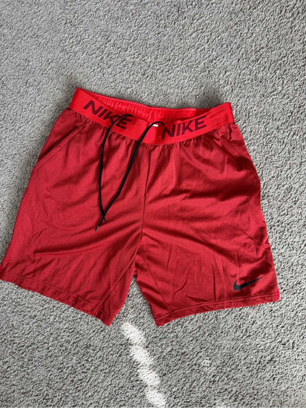 Nike Red Athletic Shorts with Black Swoosh